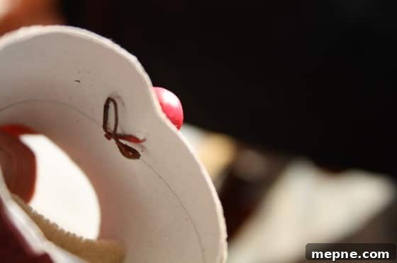 Christmas Toilet Paper Roll Reindeer Ornament for Kids 9 closeup how to attach antlers and nose to toilet paper roll