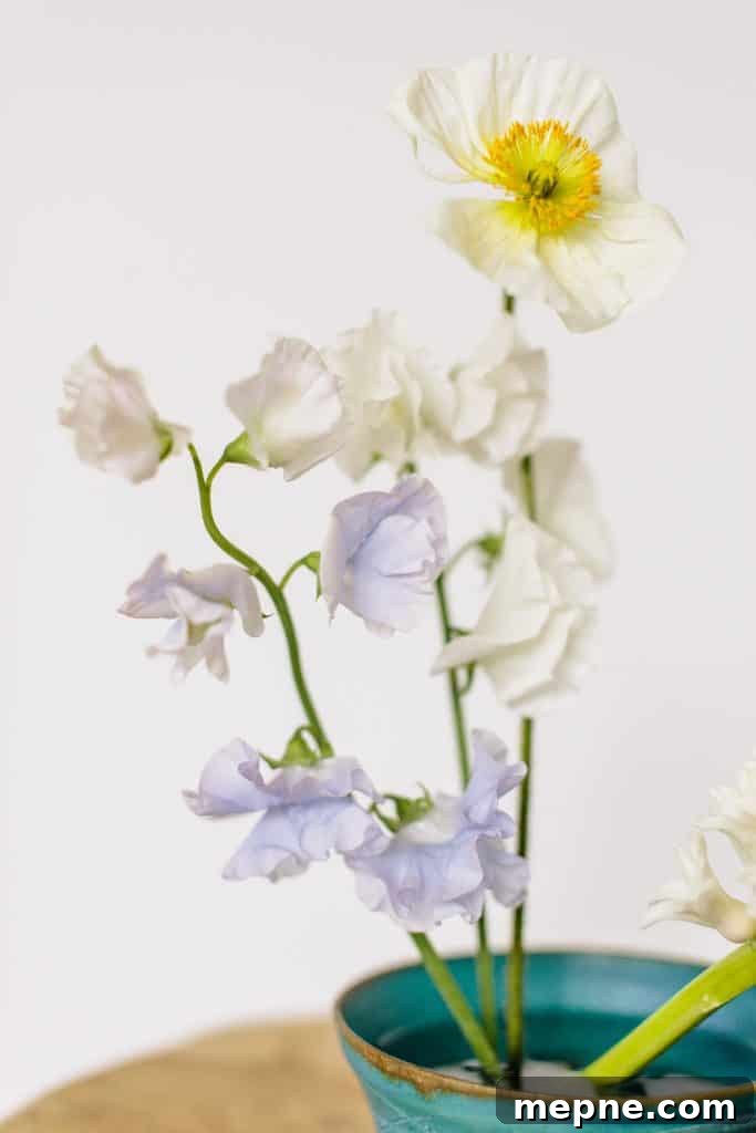 11 DIY Home Projects That Refresh Any Room 5 Minimalist Ikebana Flower Arrangement from Hello Glow