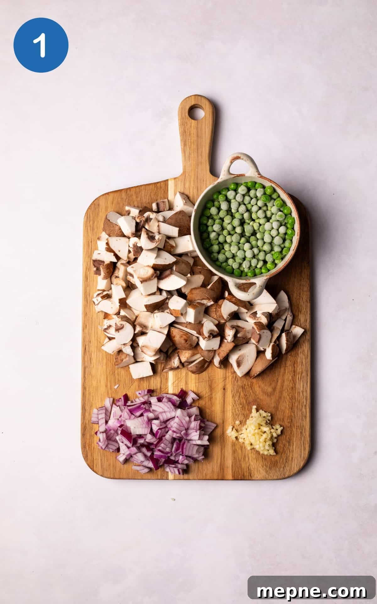 Chopped vegetables on a wooden board.