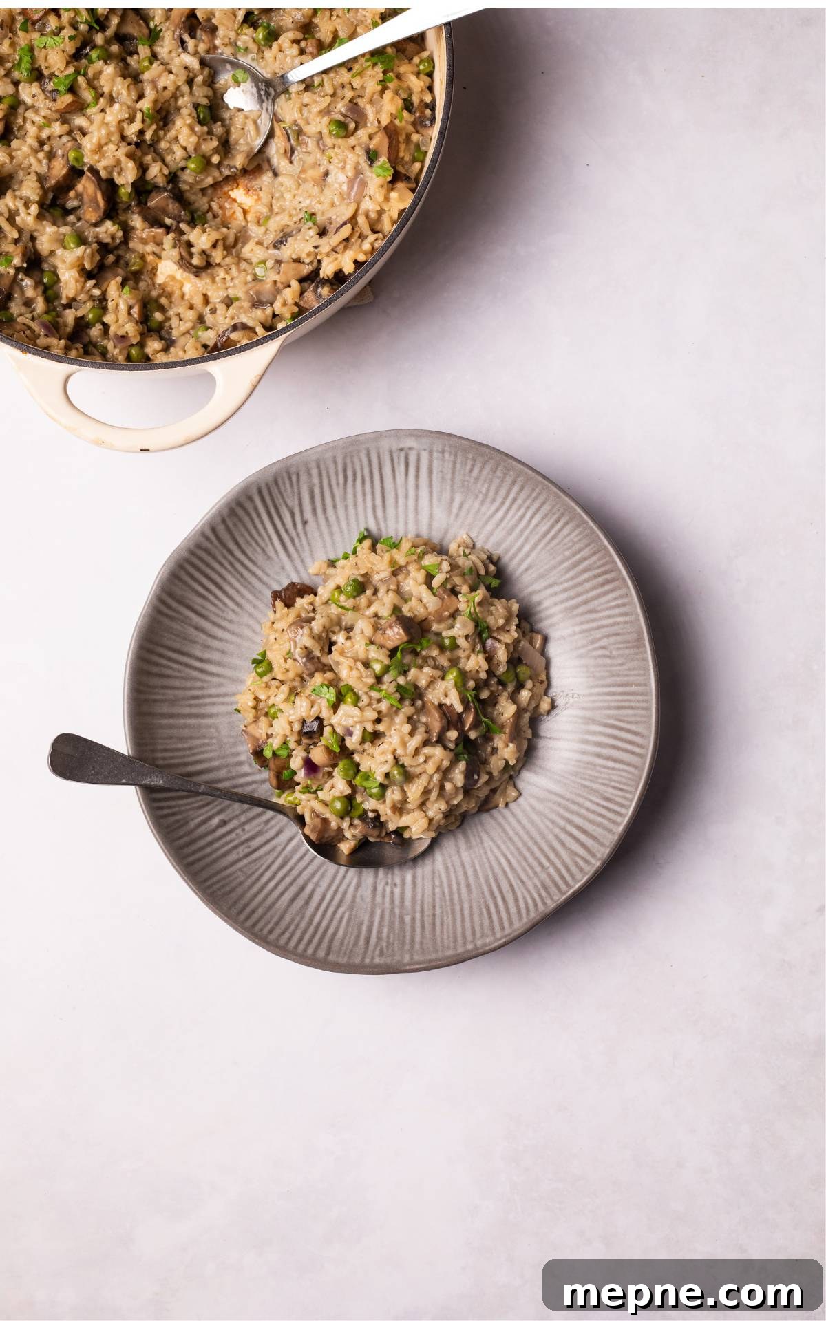 Vegan Mushroom Risotto on a grey plate.
