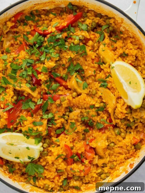 overhead shot of paella in large white pan