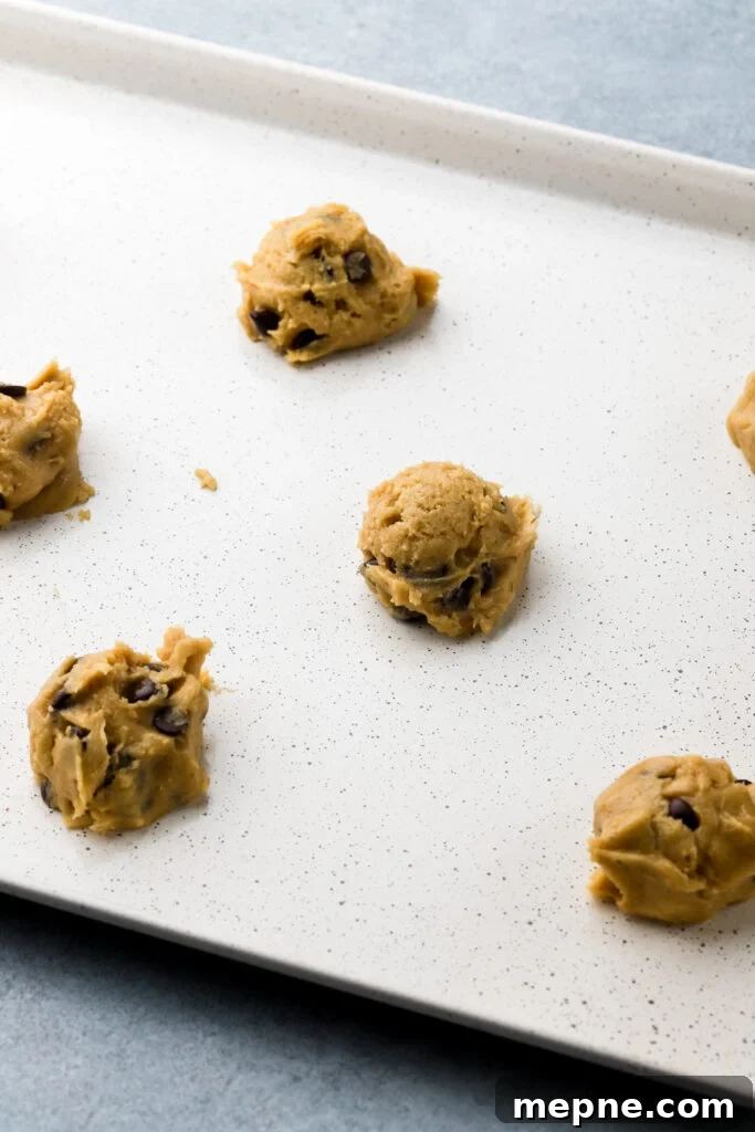 cookie dough balls on prepared pan