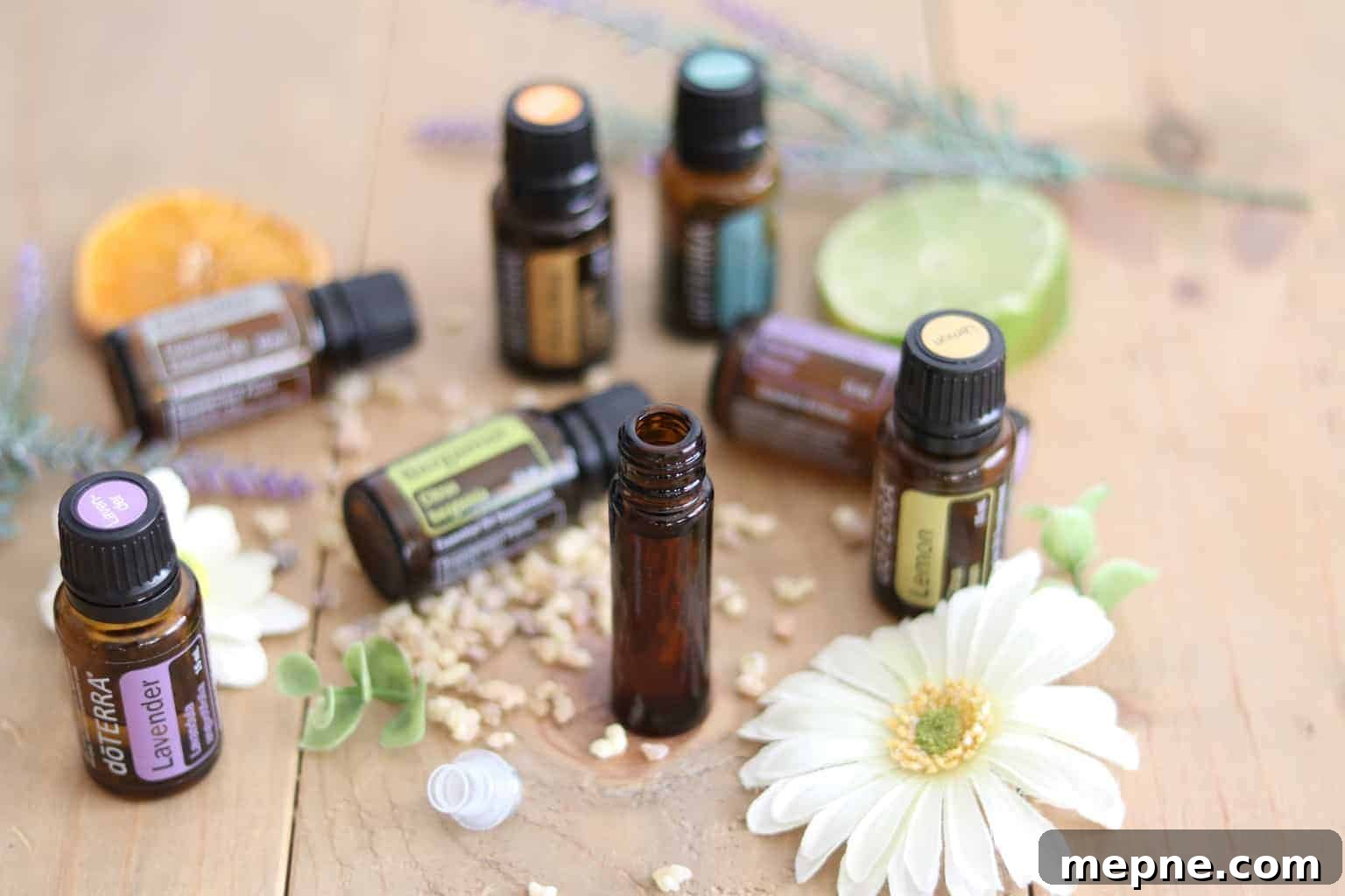 Essential Oils for Stress Relief and Anxiety 4 10mL roller bottle and amber colored essential oil bottles on table.