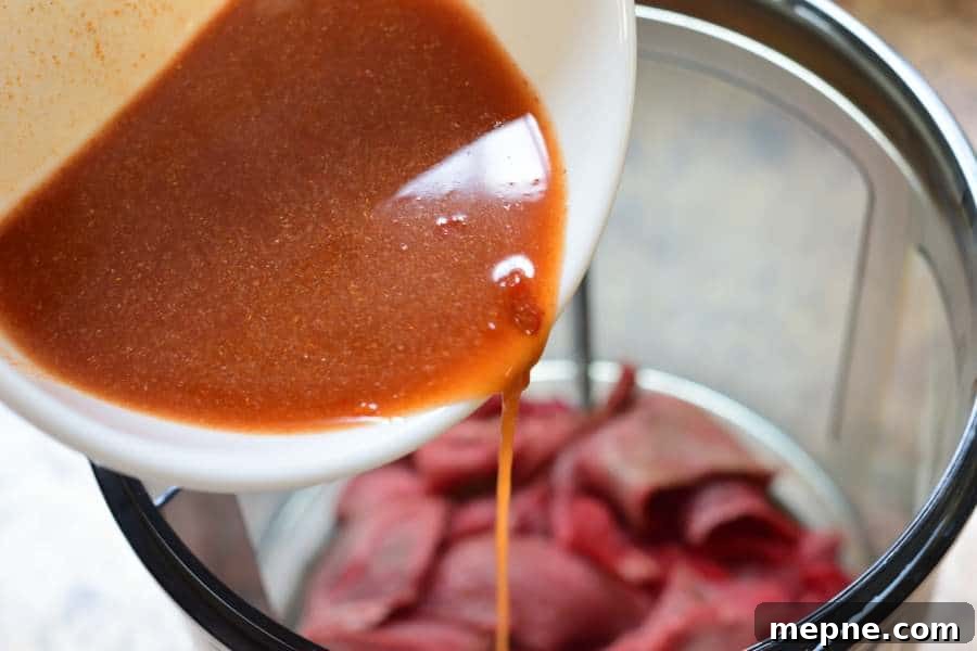 Cajun Beef Jerky from the Bayou - Spicy Southern Flavor 3 Bayou Cajun Pouring