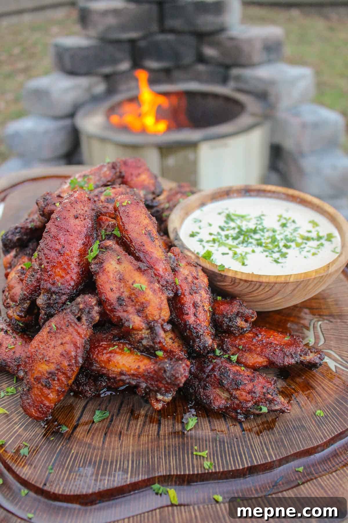 Nashville Hot Chicken Wings on a cutting board with Alabama White Sauce.