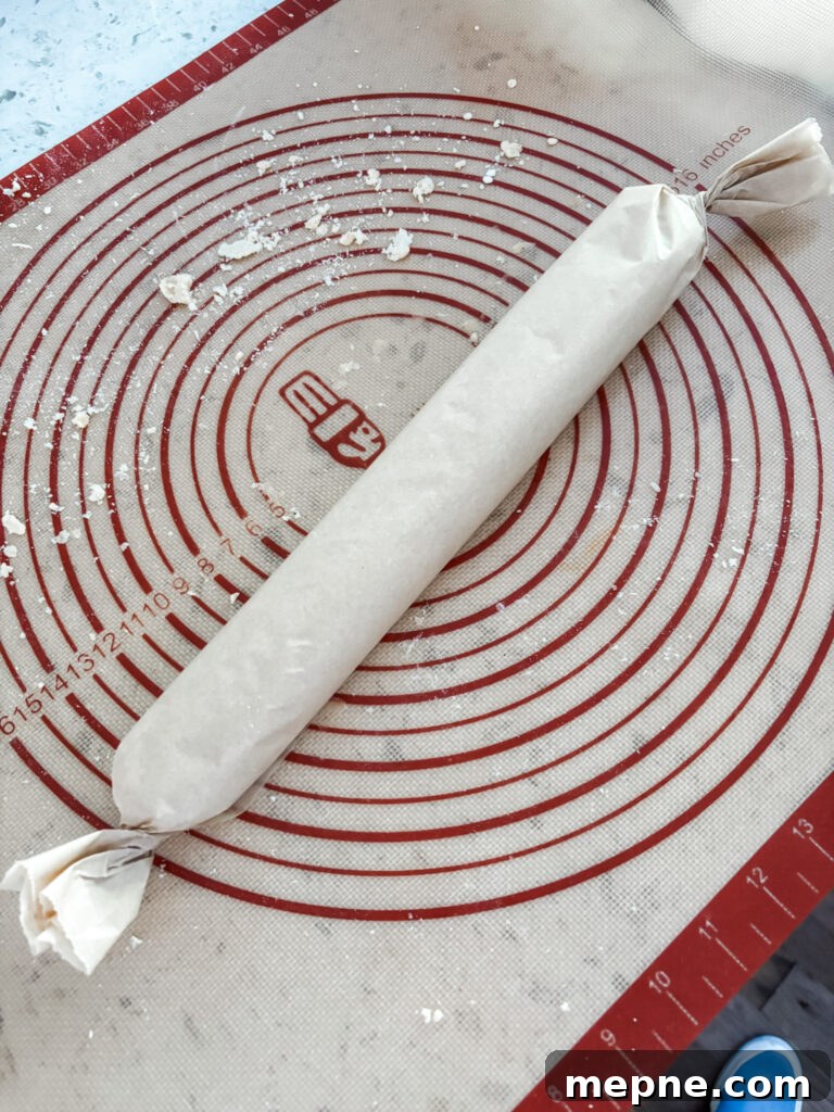 Savory Southern Pecan Cheese Wafers Recipe 5 The wafer dough wrapped in parchment paper to be chilled