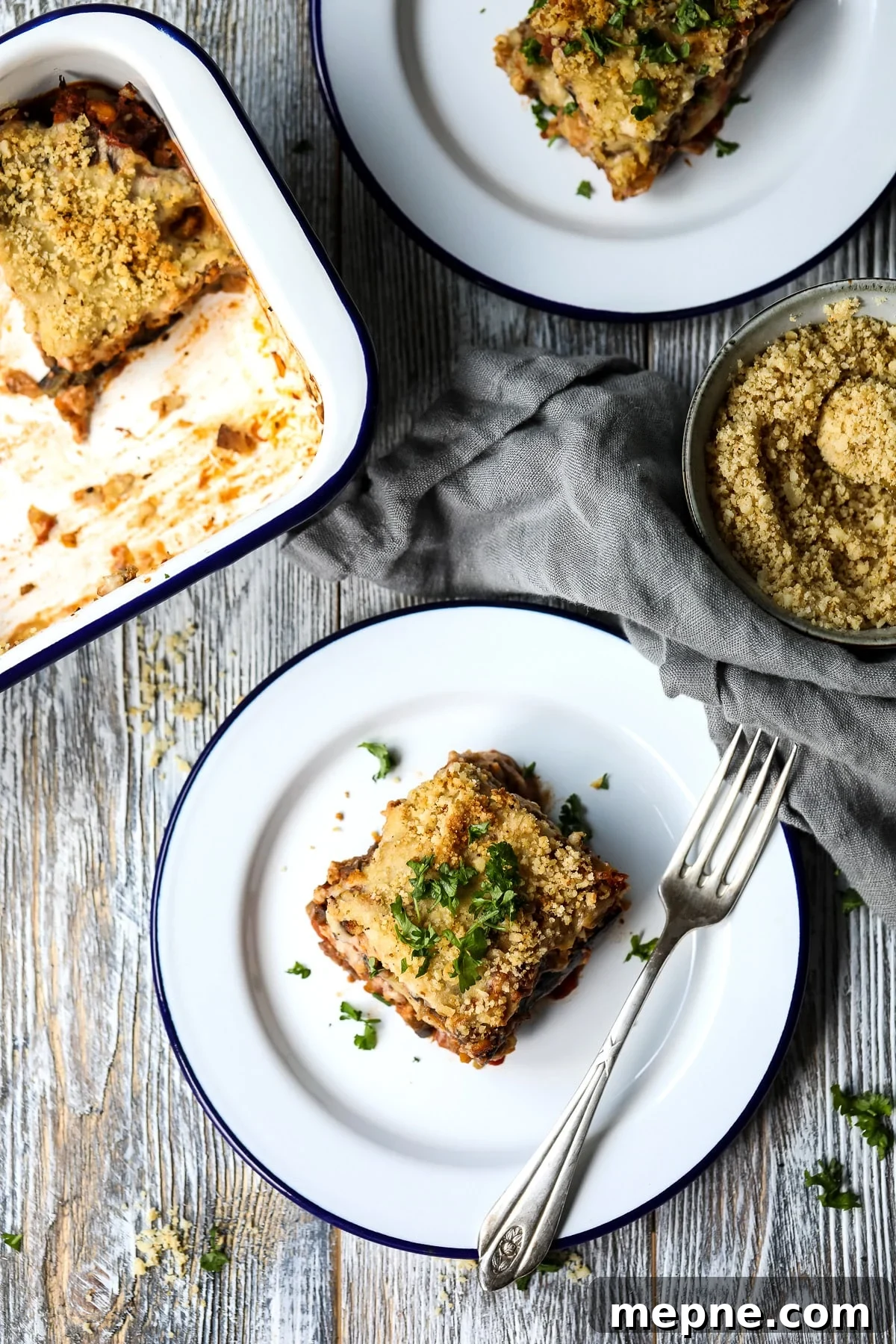 A Serving of Vegan Eggplant Lasagna Garnished with Parsley.