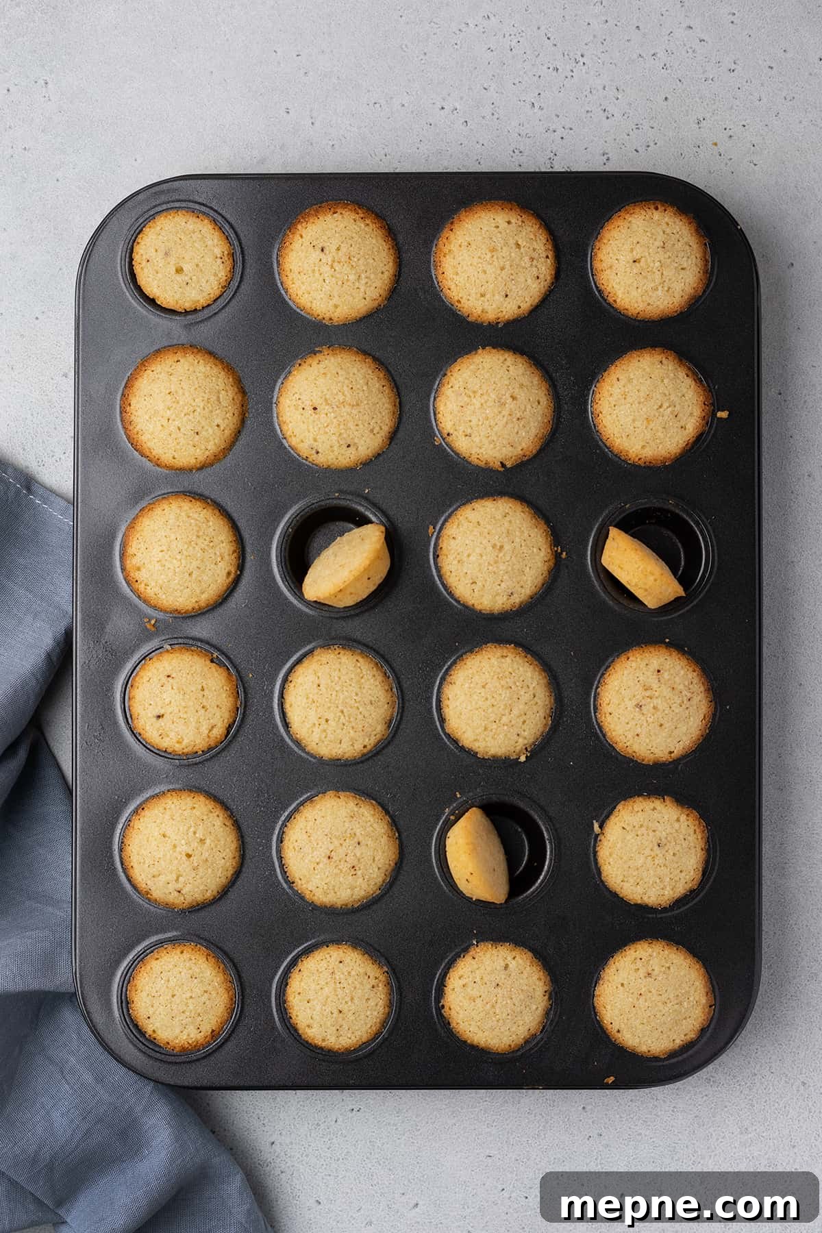 Authentic French Financiers Recipe: Classic Almond Tea Cakes 9 Baked financier cakes in a mini muffin pan