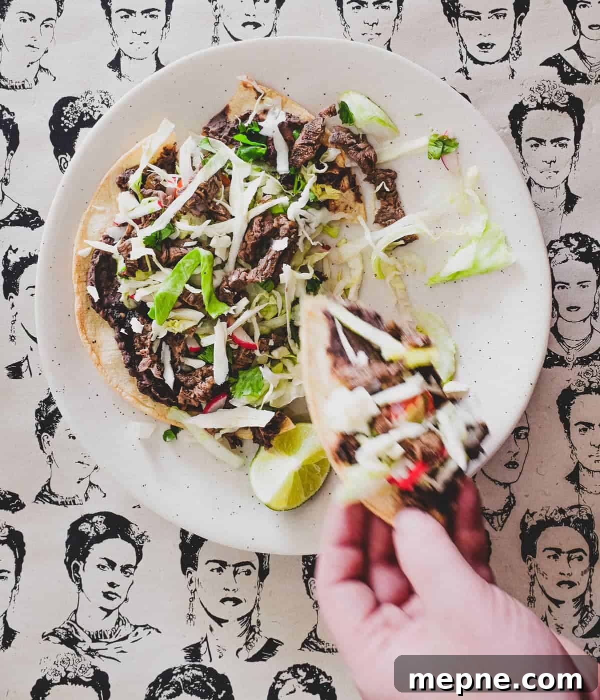 Mexican Tlayudas A plate with a Mexican tlayuda and wedge of lime