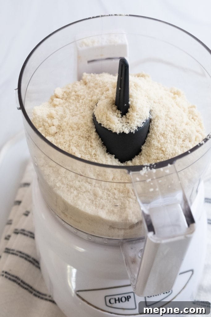 Homemade Marzipan Recipe Without Eggs or Cooking 11 Adding powdered sugar to a food processor