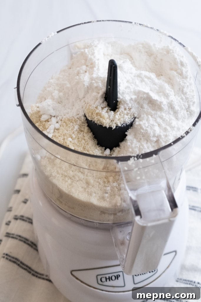 Homemade Marzipan Recipe Without Eggs or Cooking 12 Adding almond flour to a food processor