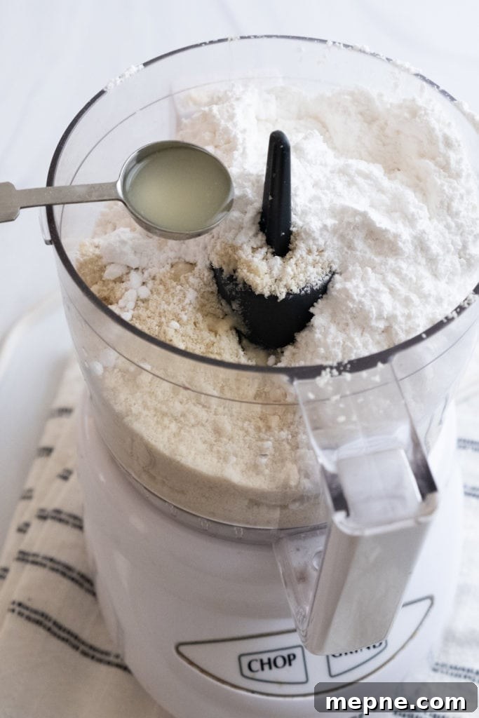 Homemade Marzipan Recipe Without Eggs or Cooking 13 Adding almond extract to marzipan ingredients