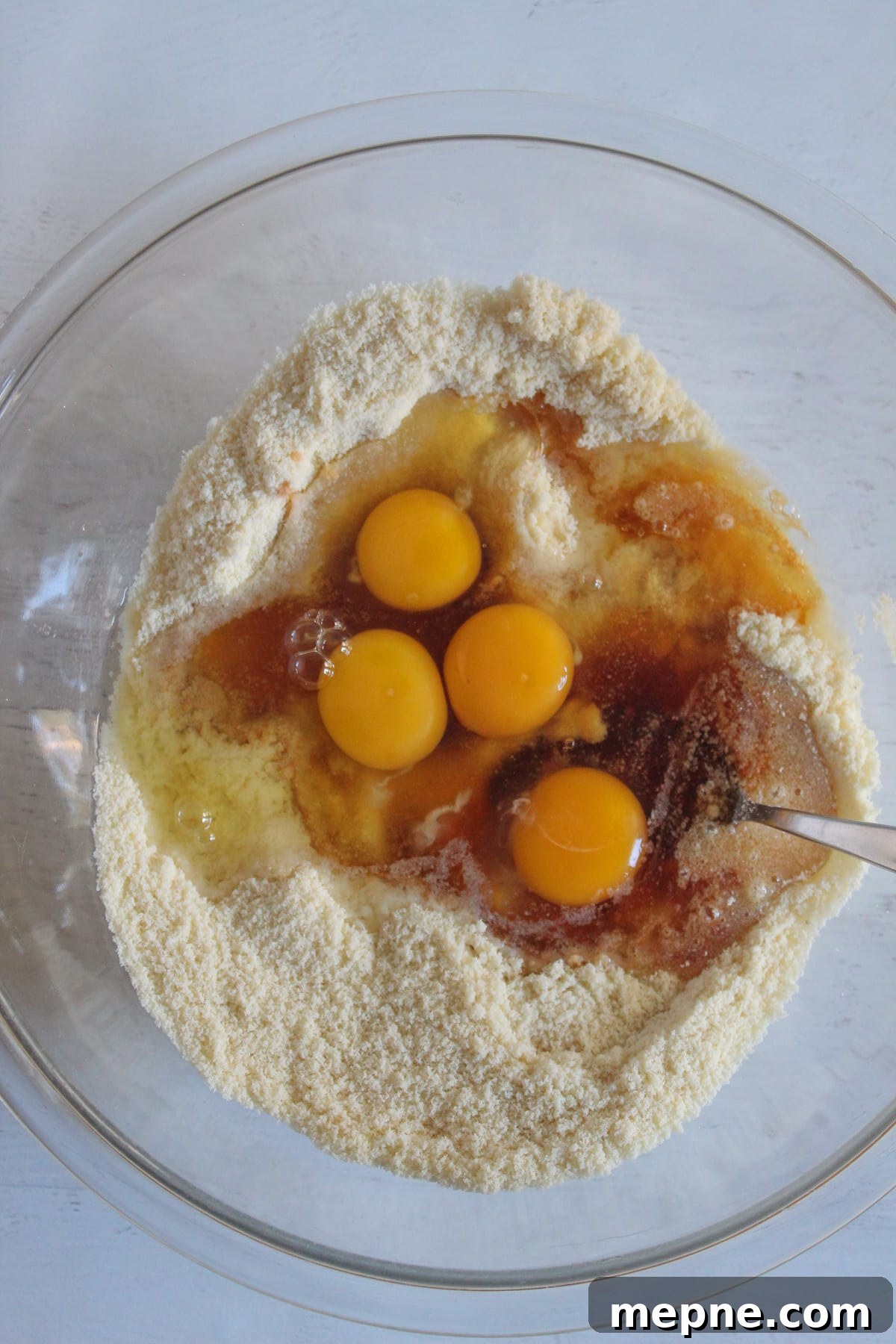 Moist Almond Flour Coffee Cake Recipe: Gluten-Free, Dairy-Free 7 eggs added to dry ingredients in a bowl