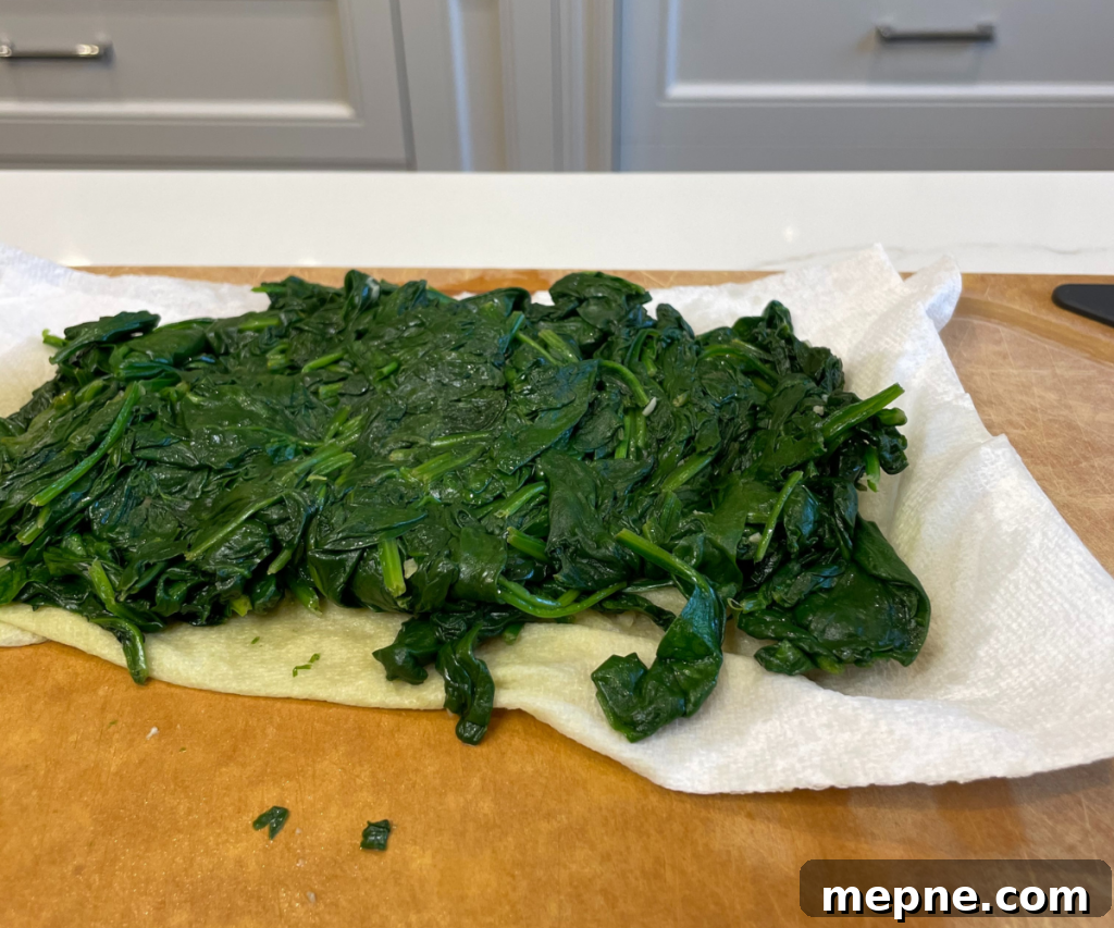 Creamy Spinach Dip with Garlic and Parmesan 3 Dry spinach with paper towel