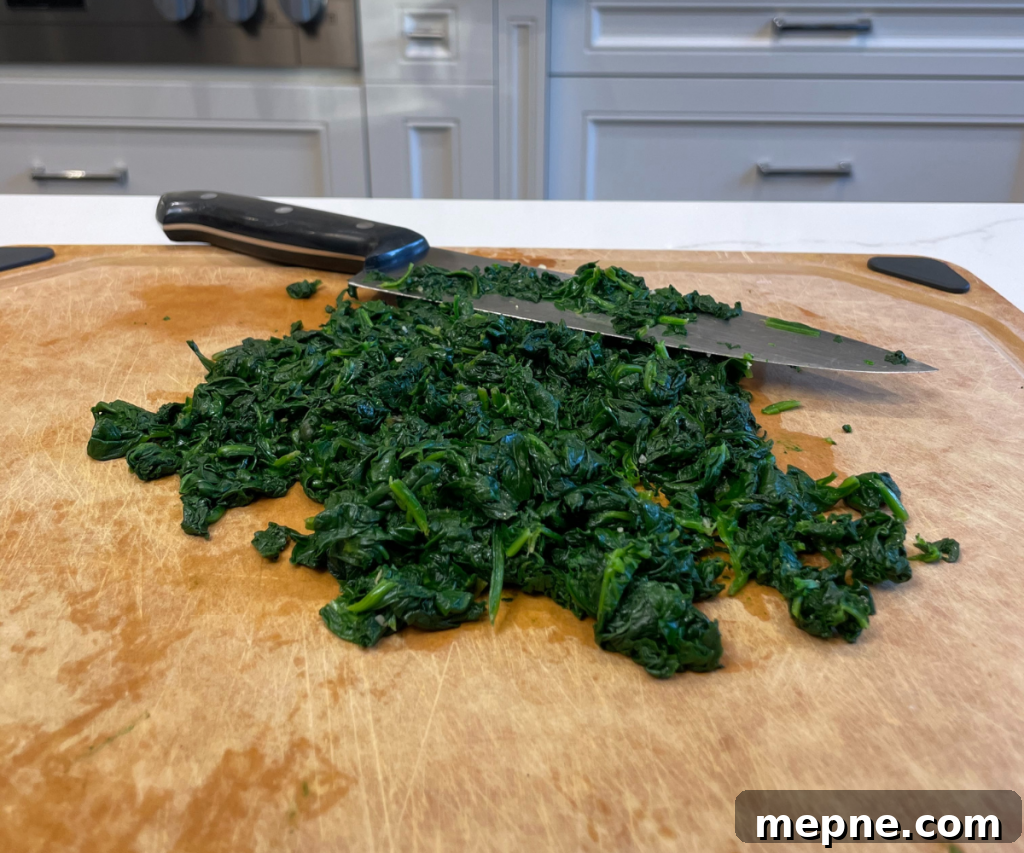 Creamy Spinach Dip with Garlic and Parmesan 4 Chop spinach into smaller pieces
