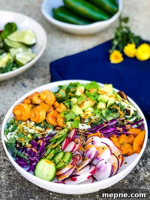 Buddha Bowl with shrimp and mixed vegetables in a white bowl