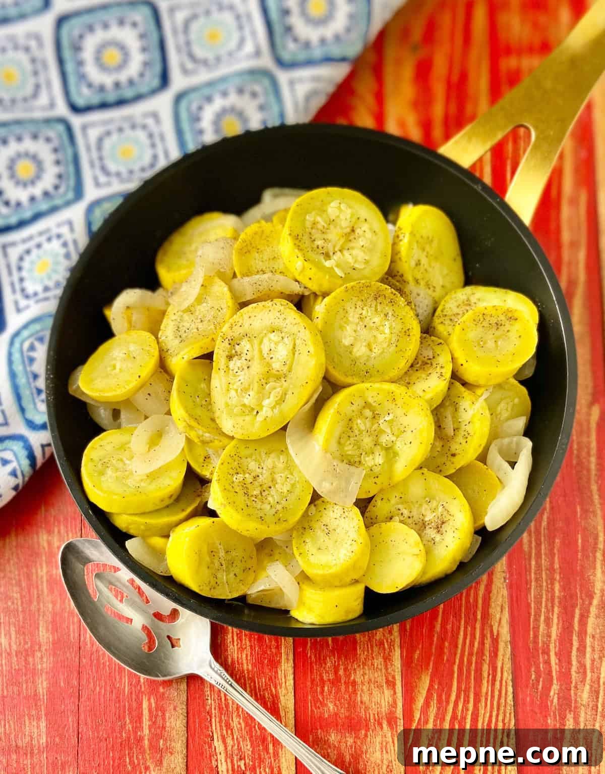 Southern Sauteed Yellow Squash with Caramelized Onions 2 Sauteed yellow squash and onions in black skillet.