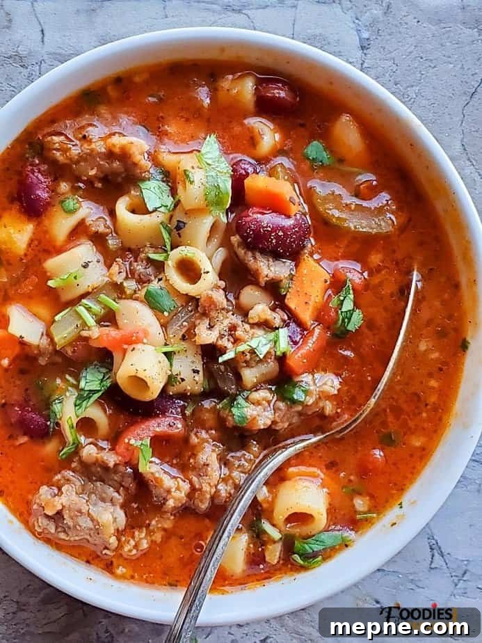 Instant Pot Olive Garden Copycat Pasta e Fagioli Recipe 2 Olive Garden Copycat Pasta e Fagioli Instant Pot served in a white bowl with a spoon