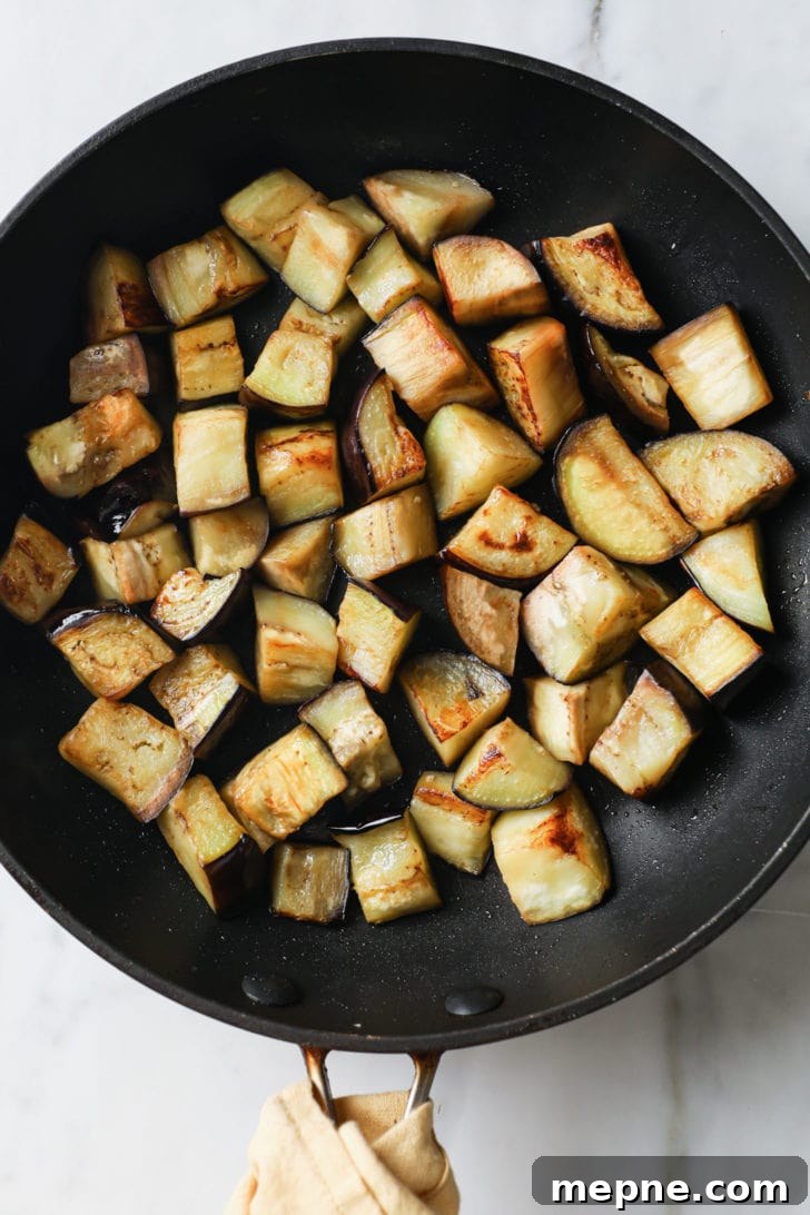 Aloo Baingan: Indian Eggplant and Potato Curry 6 Pan-fried eggplant (aubergine) in a skillet