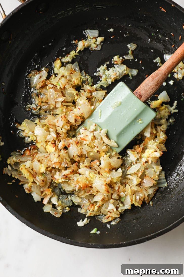 Aloo Baingan: Indian Eggplant and Potato Curry 8 Browning chopped onions in a skillet