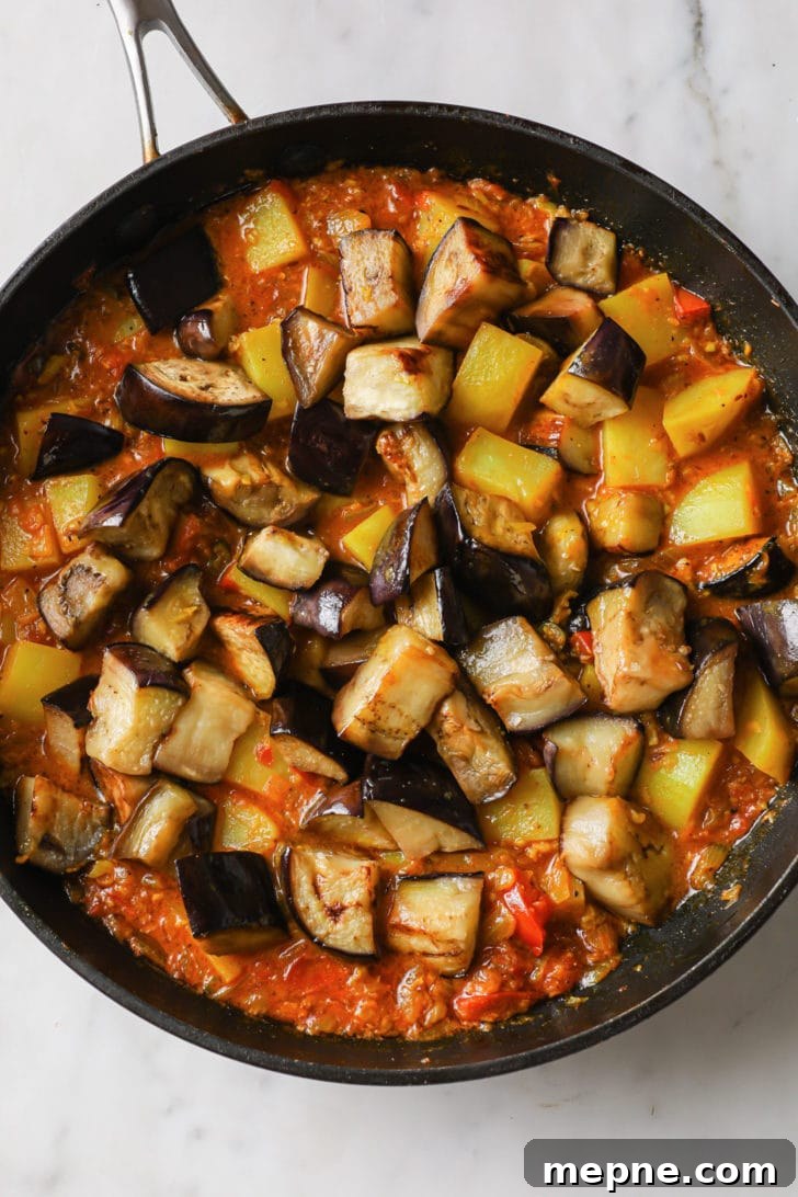 Aloo Baingan: Indian Eggplant and Potato Curry 10 Eggplant and potatoes ready to be cooked in a skillet