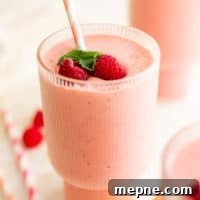 Creamy Peach and Raspberry Smoothie Recipe 5 Peach raspberry smoothie with fresh fruit.
