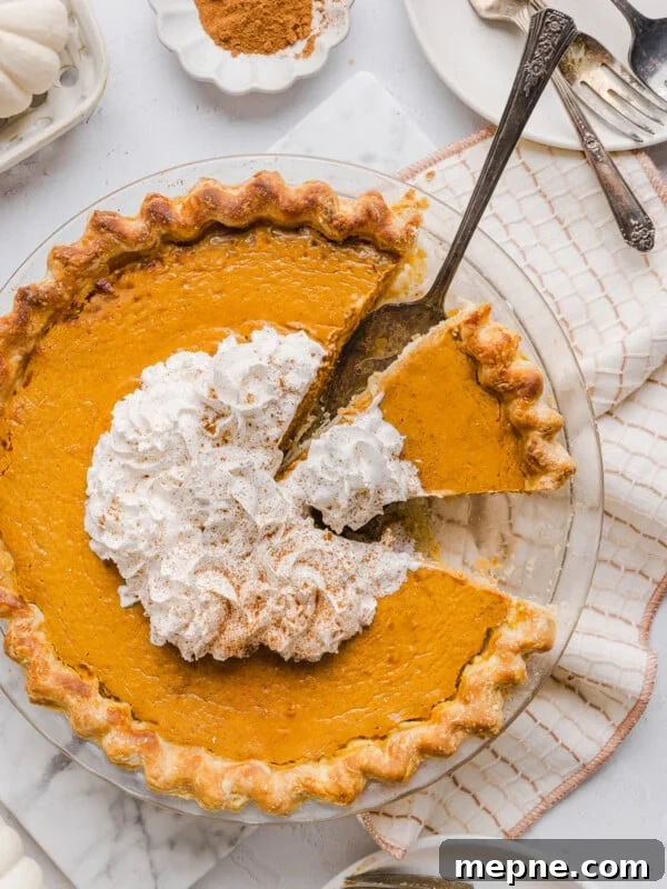 Healthy pumpkin pie topped with whipped cream.