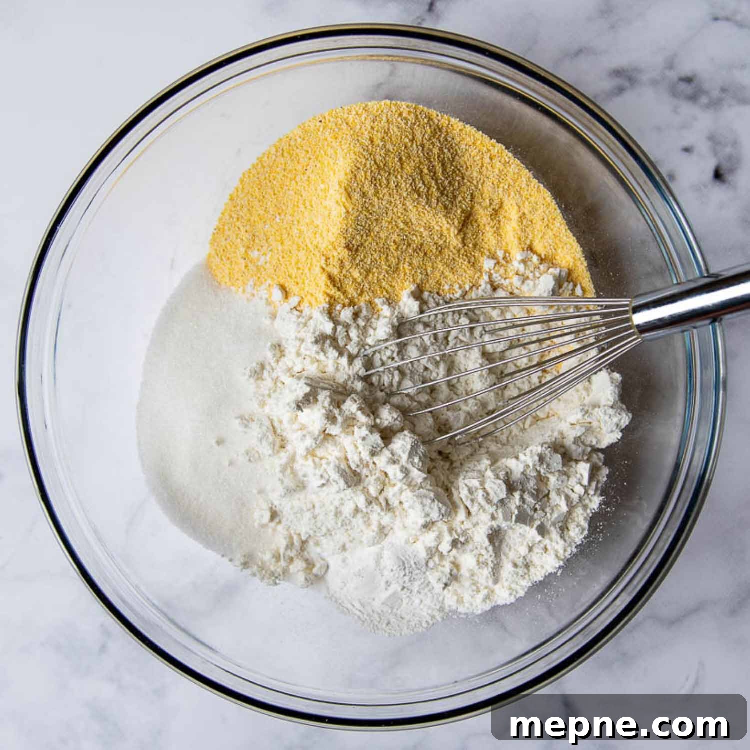 Moist Gluten Free Corn Muffins Recipe 3 the dry ingredients in a large glass bowl.