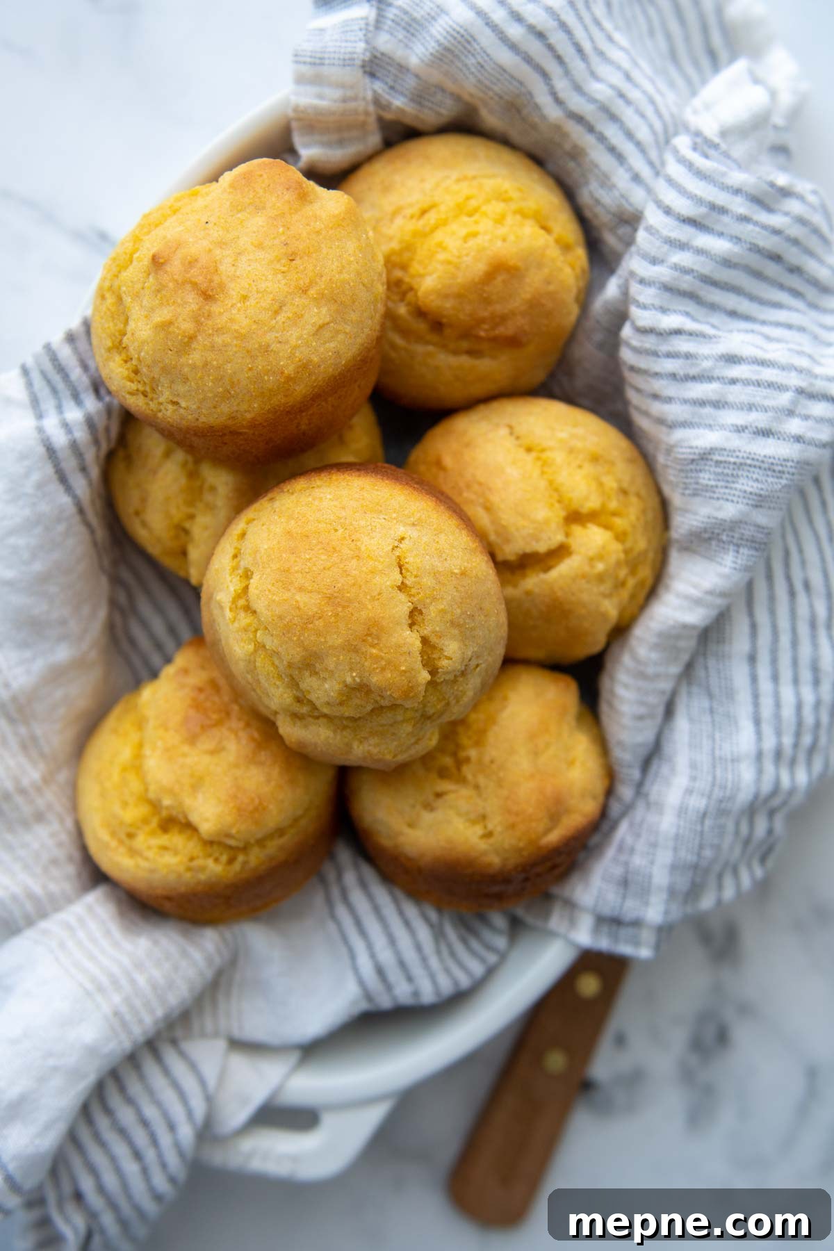 Moist Gluten Free Corn Muffins Recipe 7 overhead shot of a basket of gluten-free corn muffins