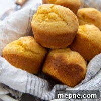 Moist Gluten Free Corn Muffins Recipe 9 a basket of corn muffins lined with a white towel