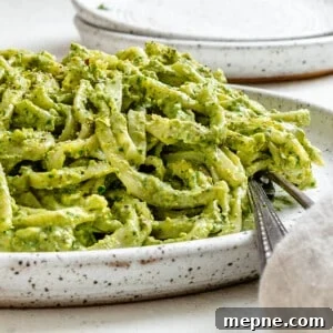 Creamy Avocado Pesto Pasta Recipe 10 completed Amazing Avocado Pesto Pasta plated against a light surface
