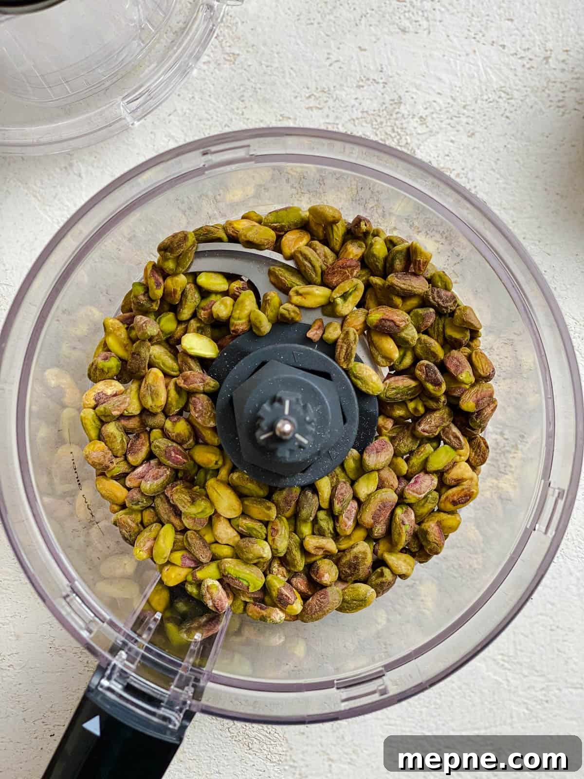 Creamy Avocado Pesto Pasta Recipe 4 process shot of pistachios added to food processor