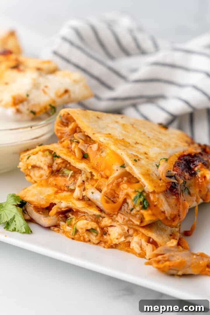 BBQ Chicken Quesadilla stacked on white plate