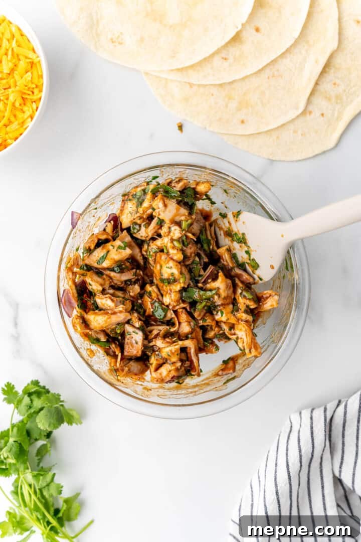 mixing quesadilla ingredients in the glass bowl