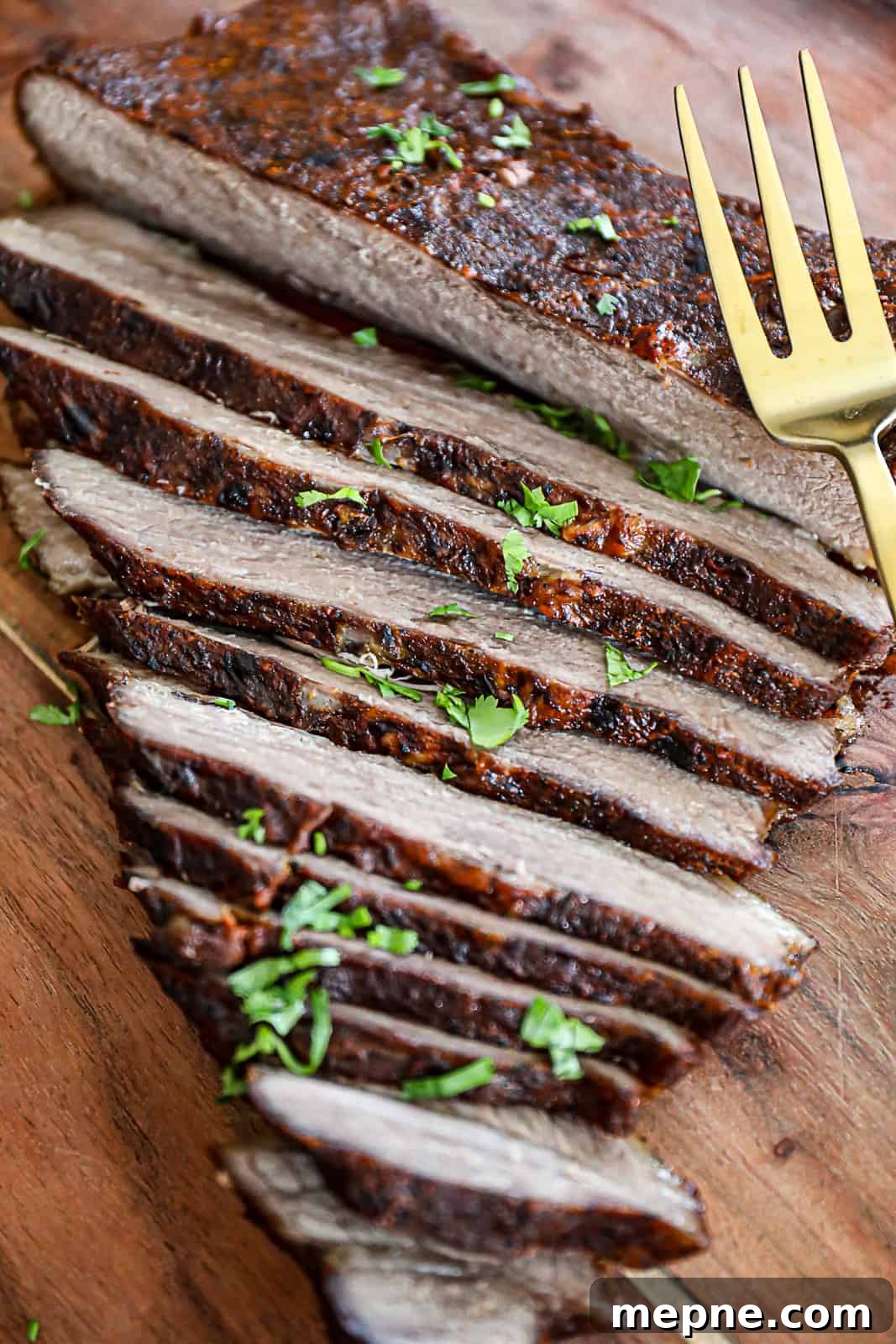 Oven Baked Beef Brisket Sliced On Cutting Board