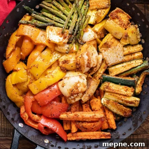 Smoked Side Dishes for BBQ and Cookouts 22 A skillet filled with vegetables and other ingredients