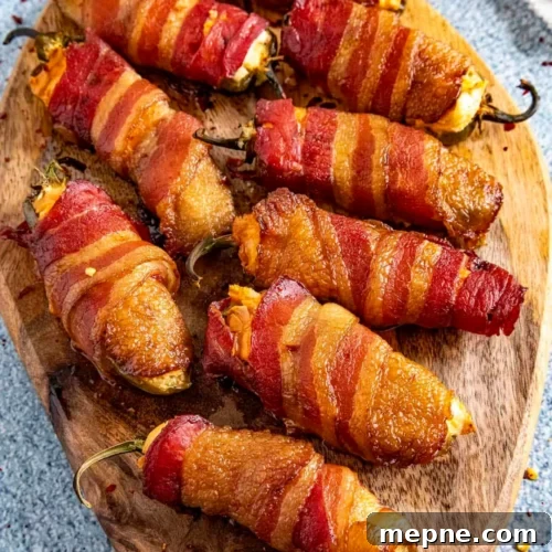 Smoked Side Dishes for BBQ and Cookouts 30 Bacon wrapped peppers on a cutting board