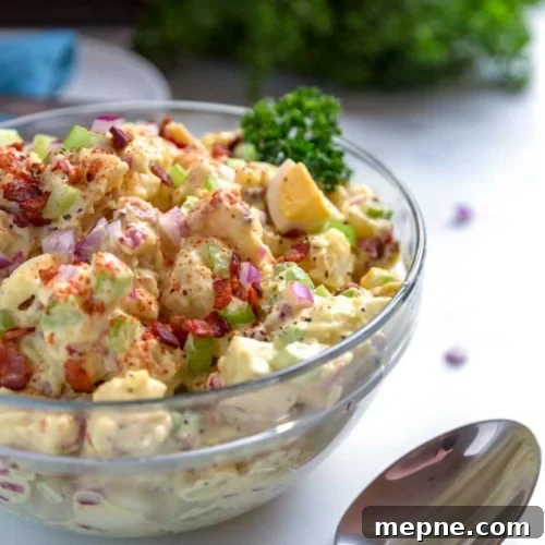 Smoked Side Dishes for BBQ and Cookouts 31 A bowl of potato salad with a spoon