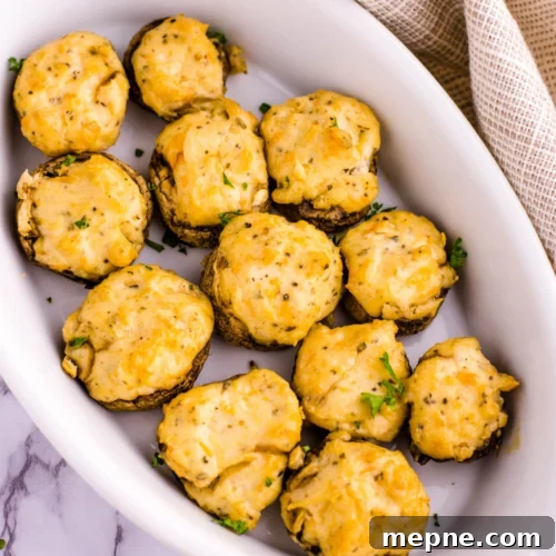 Smoked Side Dishes for BBQ and Cookouts 33 A white dish filled with cheese and mushrooms