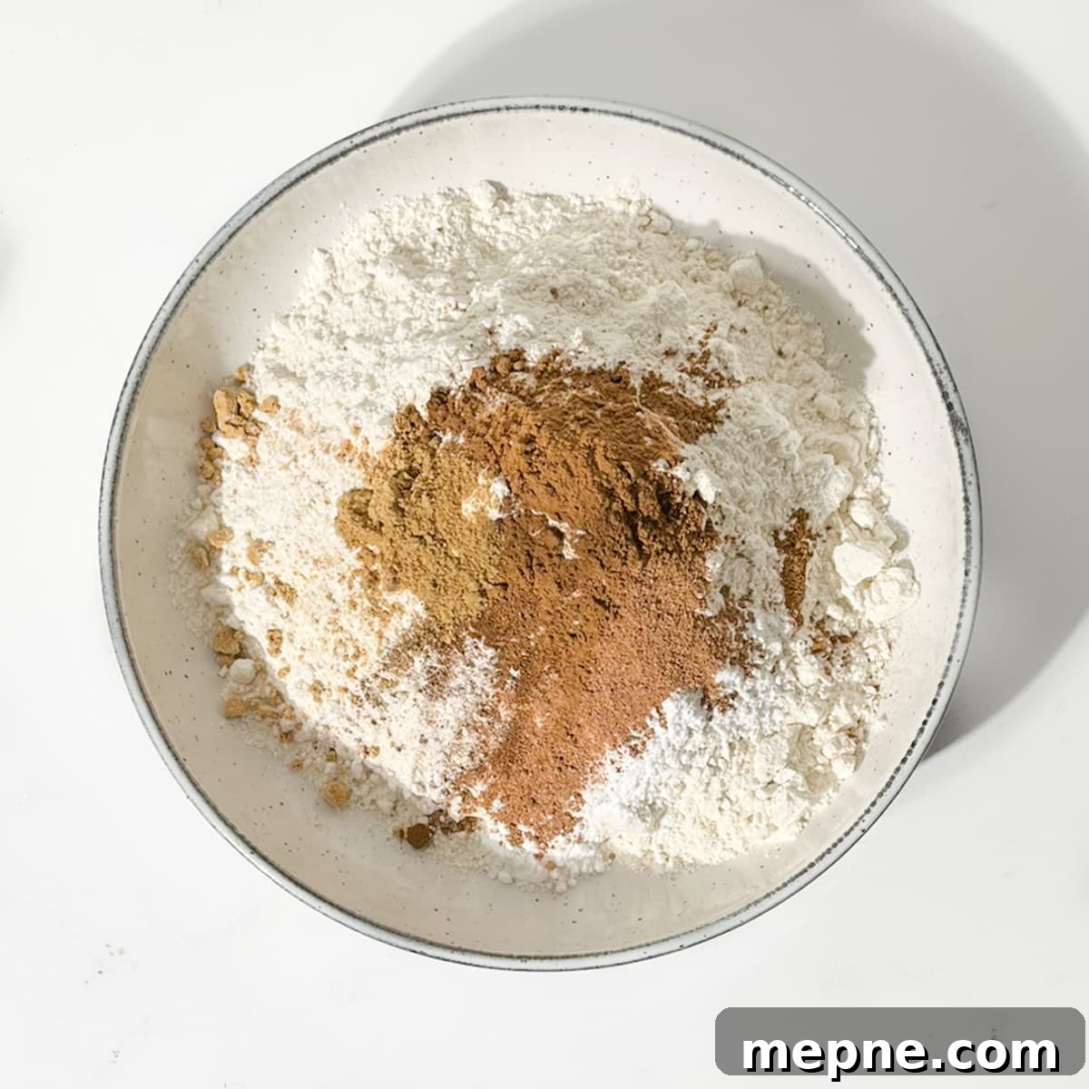 Old Fashioned South African Spice Biscuits (Soetkoekies) Recipe 4 Adding spices to dry ingredients for spice biscuits.