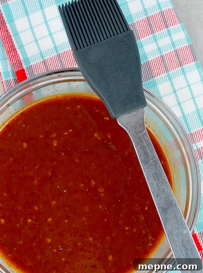 Homemade Chipotle Brown Sugar BBQ Sauce Recipe 2 Homemade Chipotle Brown Sugar Barbecue Sauce in a clear bowl with a plaid napkin