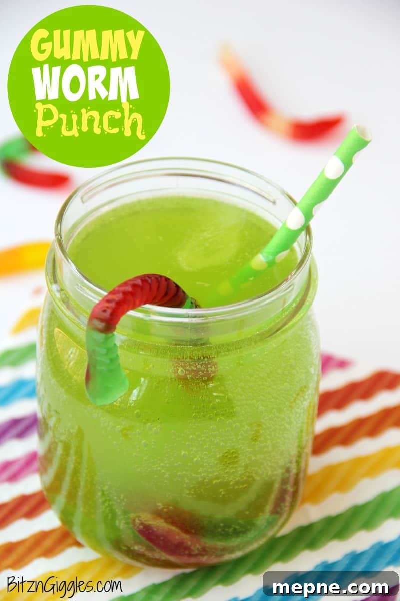 Green punch drink with gummy worms.