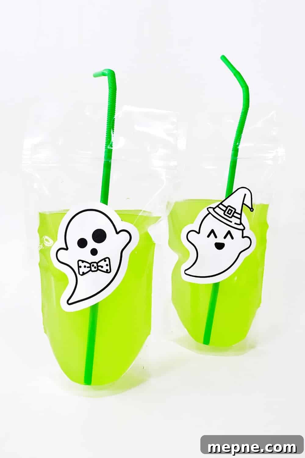 Green drink in a punch with ghost sticker.