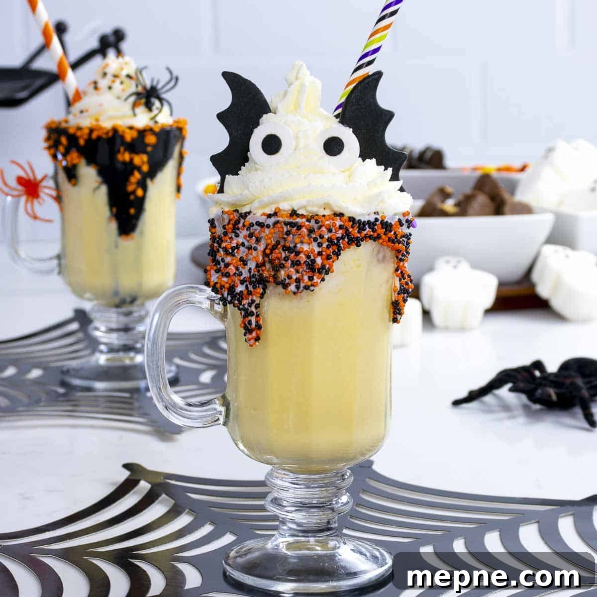 Vanilla Halloween milkshake for kids with eyes and bat wings.