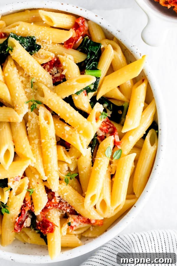 Sun-Dried Tomato and Kale Pasta Recipe 7 Sun dried Tomato and Kale Pasta garnished with extra grated Parmesan.