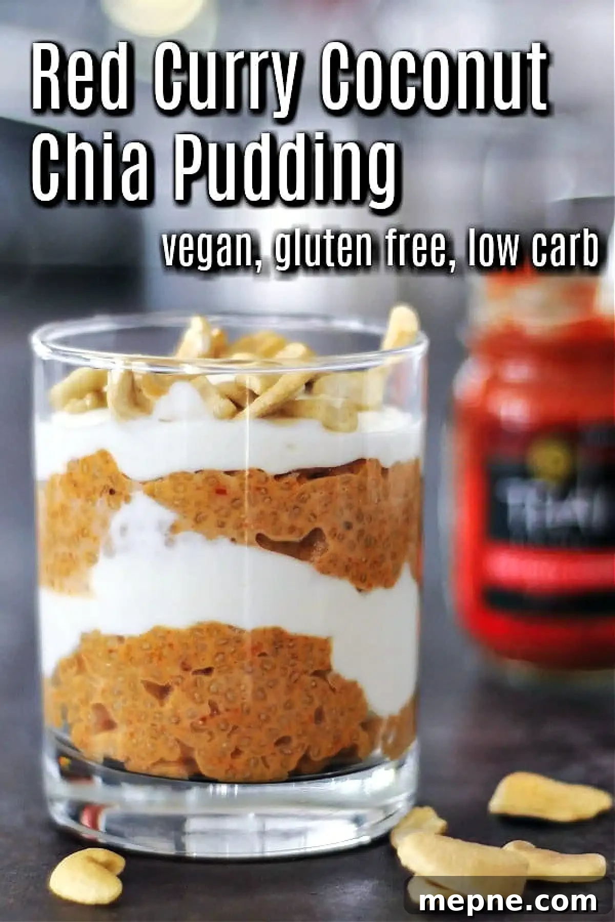 Savory Red Curry Chia Pudding @spabettie #glutenfree #lowcarb #vegan #dairyfree #recipe Red curry coconut chia pudding and cashew cream layered in a glass, red curry paste jar in background.
