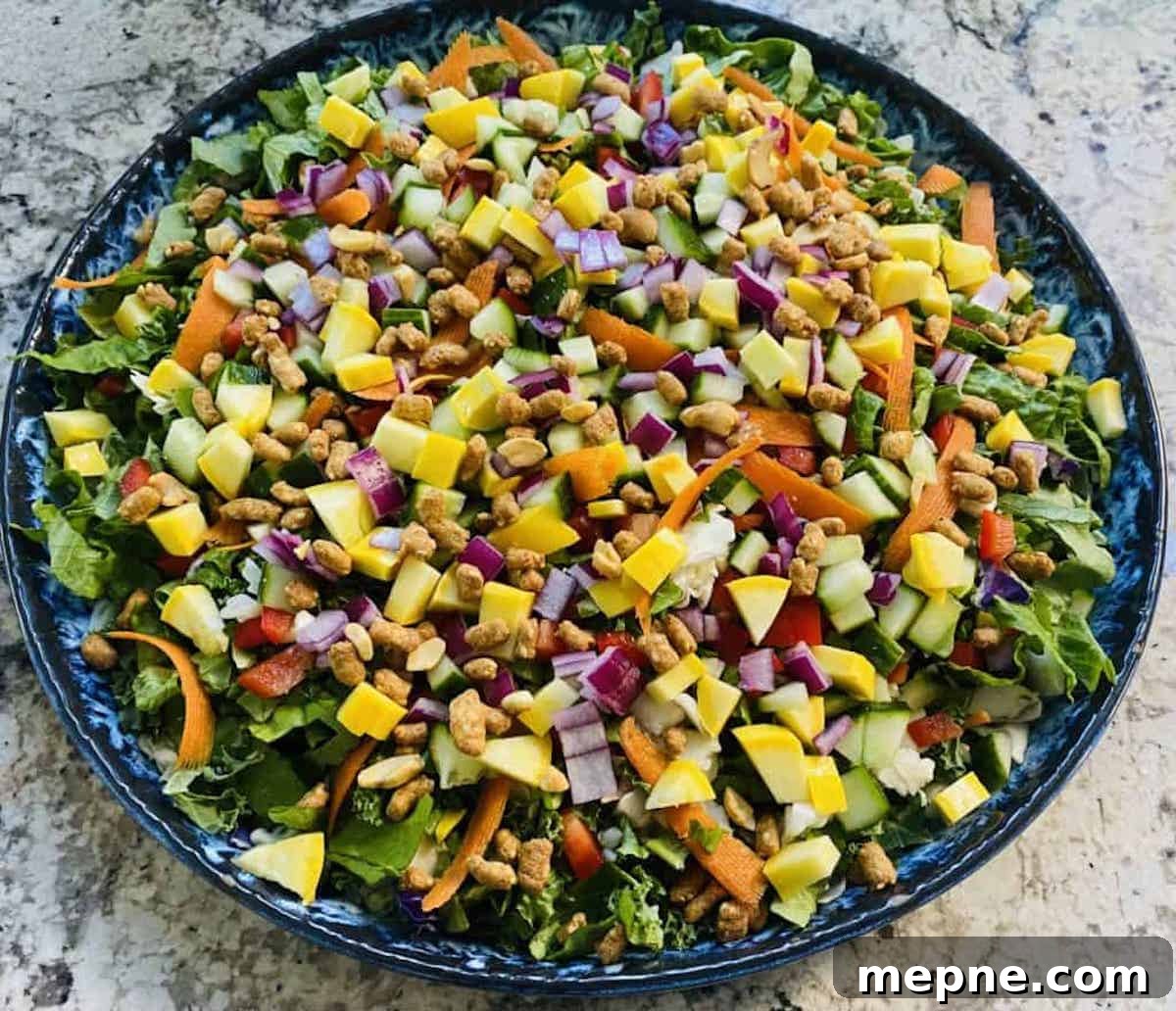 Asian Chopped Salad Recipe with Sesame Ginger Dressing 5 Chopped Asian salad on a plate on the table.