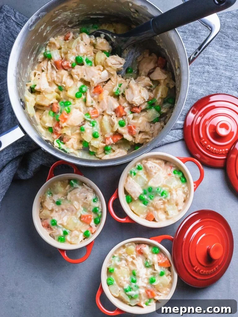 Chicken Pot Pie with Flaky Puff Pastry Crust 5 easy chicken pot pie filling in pot and red ramekins