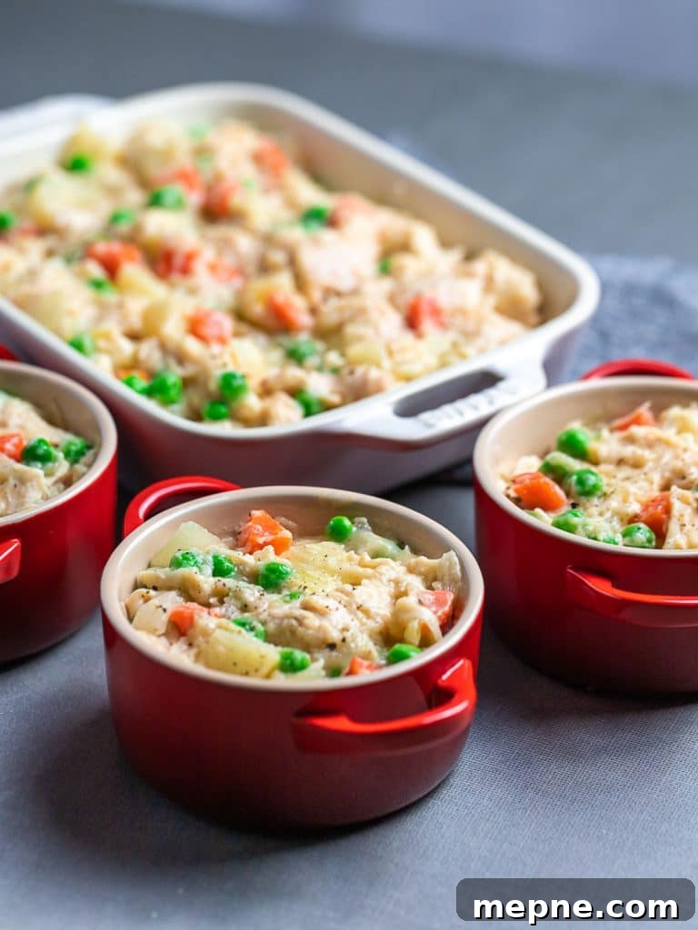 Chicken Pot Pie with Flaky Puff Pastry Crust 6 easy chicken pot pie filling in red ramekins and casserole dish