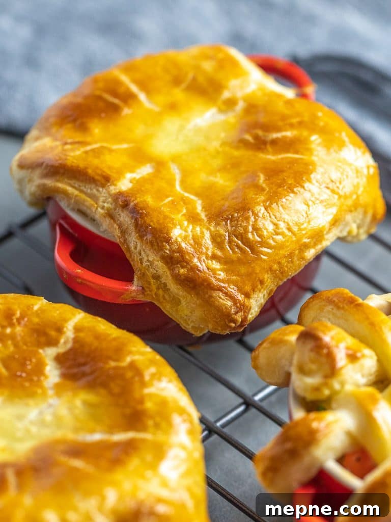 Chicken Pot Pie with Flaky Puff Pastry Crust 8 easy chicken pot pie with puff pastry crust in red ramekins